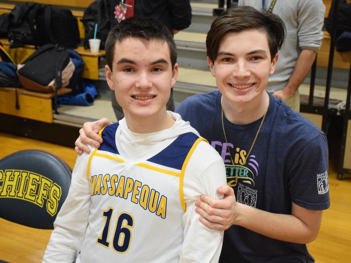 Ryan and John O'Fee prepare for senior night in Massapequa's Challenger League Basketball program. 