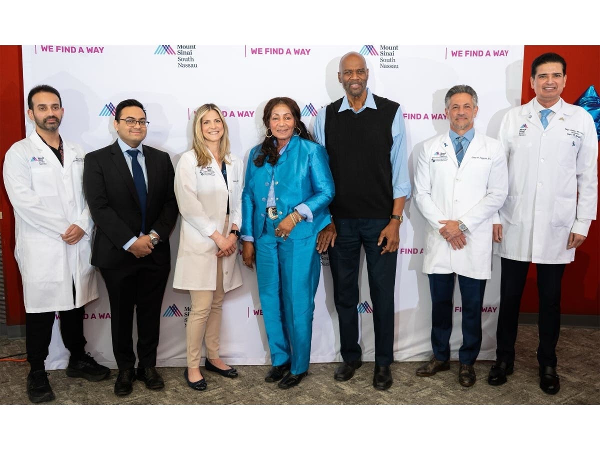 Althea Harry, 73 of Freeport, NY, and her husband, Hewley, with members of the Mount Sinai South Nassau staff. 