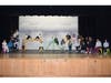 The cast of "Dare to Dream Junior" rehearses their musical revue. 