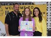 Middle school poster contest winner Alison Amador (center) with Wantagh Middle School principal Anthony Ciuffo (left) and Assistant Principal Rachel Quattrocchi (right) 