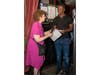 Sky Samedy accepts his United For Change scholarship award from UFC treasurer Rhonda Eisenberg. 