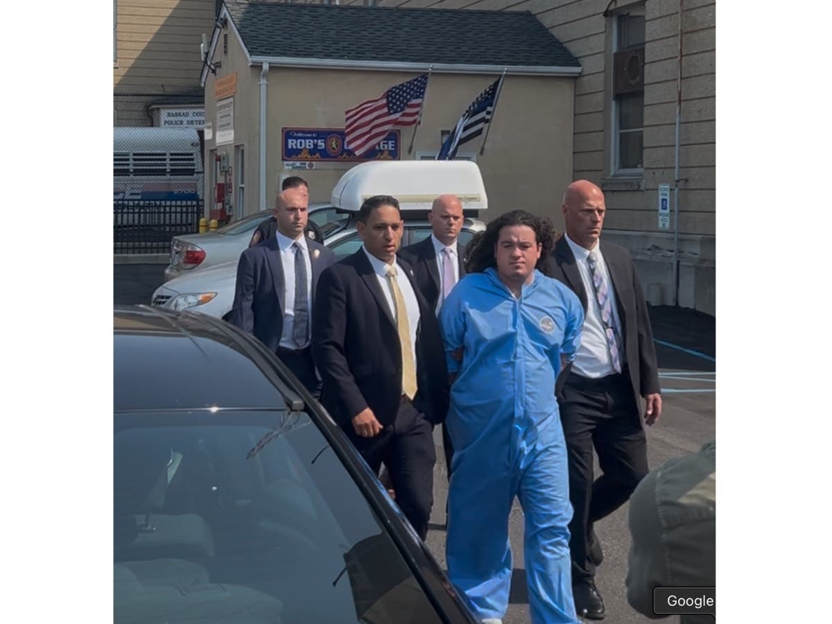 Joseph Horner is escorted to his arraignment by police. 