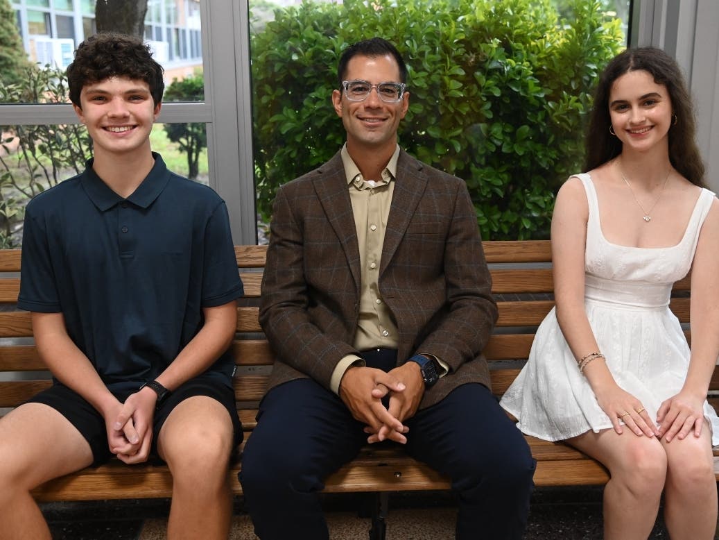 Seniors Matthew Como (left) and Lauren Furer (right) were named semifinalists this week in the National Merit Scholarship program. Principal Dr. Paul Guzzone (center) called the achievement "a proud moment for Wantagh High School."