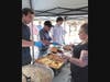 Family and friends celebrate with graduates a picnic in their honor. 