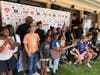 Pictured - Guitar recipients gather at the 4th Annual Nashville Free Guitars for Kids 100 Guitar Giveaway, held at the Hard Rock Café in downtown Nashville. 