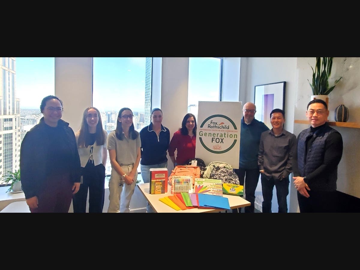 Pictured from left,Danielle Sze, Elizabeth Kennedy, Kate Makarin, Courtney Brooks, Veronica Magda, Branko Kalezic, Luan Tran, and Kenny Tsai, with school supplies for local students in foster care.