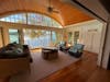 Home one, on the edge of Roberts Cove, is a spacious, open-concept home with large living area, a four-season porch, and scenic water views. The home features a walk-out game room, stone patio, and private beach with docks offering direct lake access.