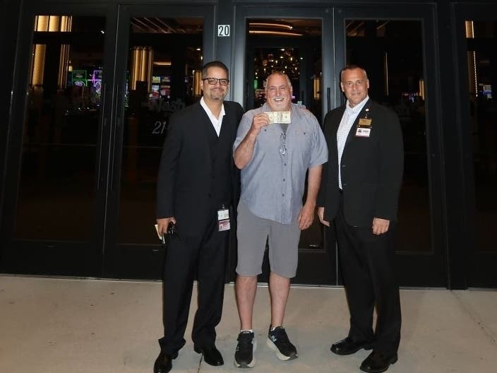 Pictured from left is Manager on Duty Angel Galarza, the jackpot winner and Assistant Gaming Shift Manager Brett Yeomans.