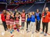 Houston North District female athletes proudly take center court after the annual All-Star Game, celebrating their achievement and showcasing their hard earned medals.