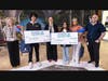 Harmony School of Discovery Houston students Deven V. and Keya J. celebrate their Commit for Life scholarship awards alongside family members and school leaders.