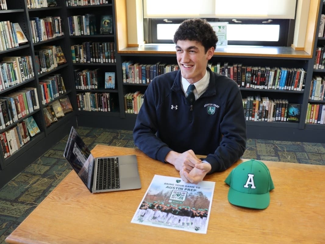 Ty Mathieu ’27 works on a baseball recruiting poster for prospective student-athletes at Austin Prep. The junior pitcher has built Mathieu Media, creating custom graphics for teammates and athletic programs.
