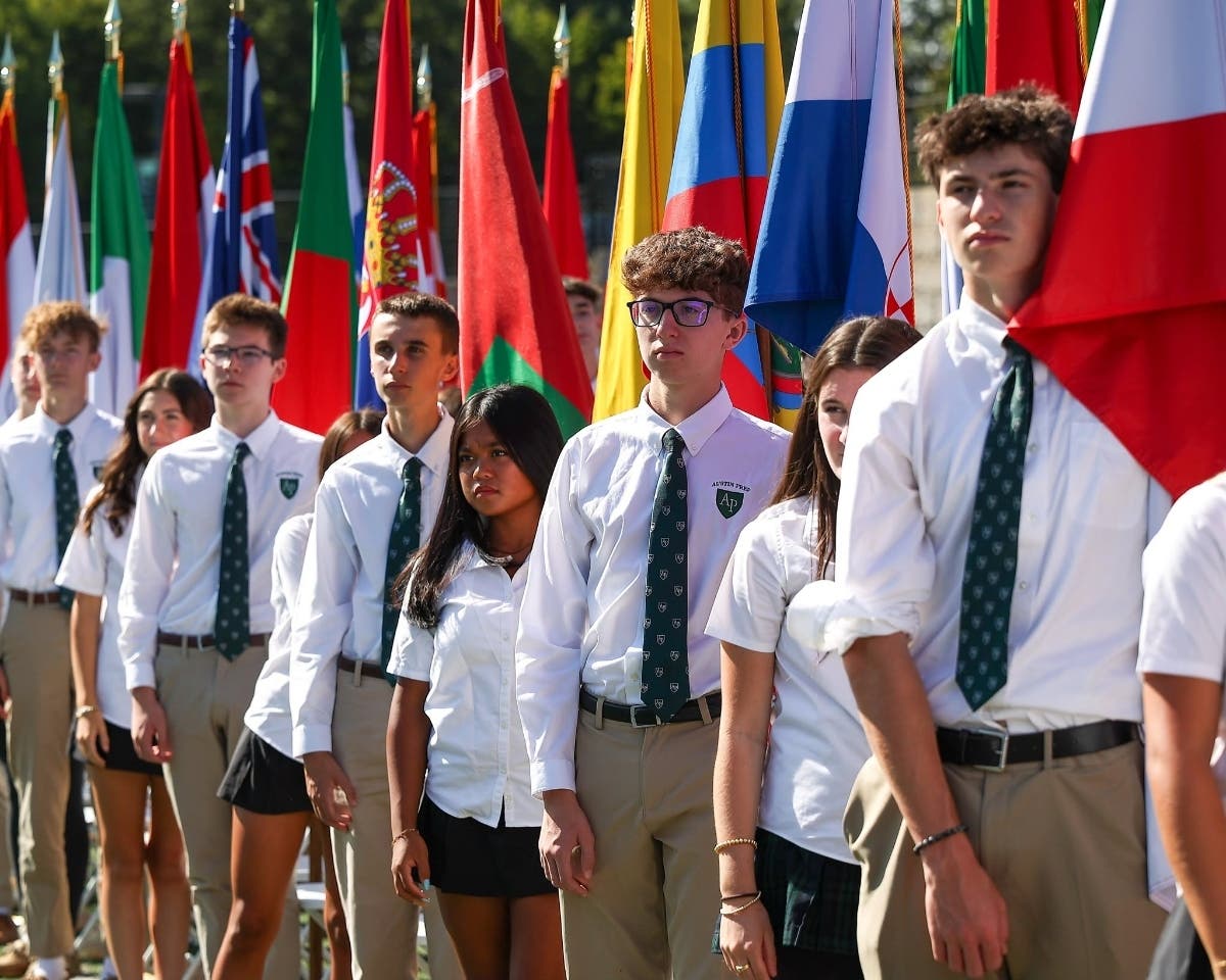 Flag carriers representing the nations of the Austin Prep community during Convocation.

