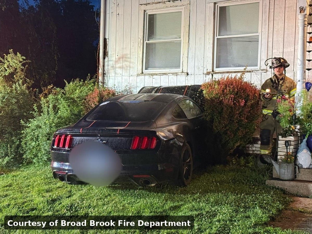 Fire officials reported minor injuries after a car crashed into a house Wednesday.