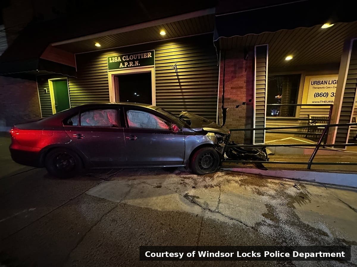 An Enfield woman was charged with DUI after a car crashed into a building at 250 Main St. in Windsor Locks early Friday, according to police.