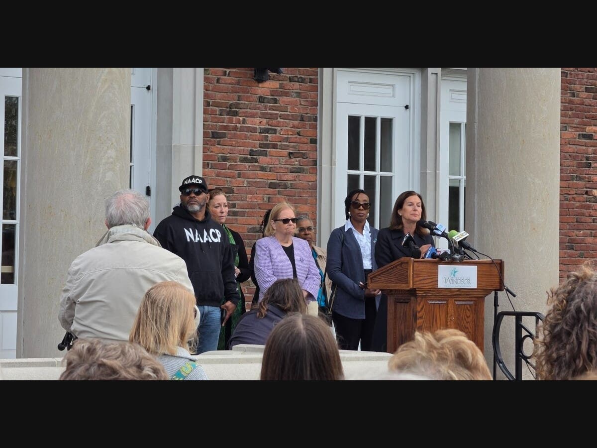 Lt. Gov. Susan Bysiewicz speaks outside Windsor Town Hall on Friday during a press conference addressing recent acts of hate in town.