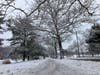 A sidewalk covered in snow after a winter storm in Hillsborough, NJ