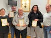 Winning top honors at the TSF Trivia Team Challenge was the team of Pug Mom Strong.  Team members from the O’Leary family (left to right) Sarah, Mark, Jack and Timothy O’Leary are congratulated by TSF President T.J. White.
