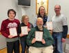 Eponymous, a consistently strong Trivia Team Challenge team, captured third-place honors at TSF’s Trivia Team Challenge. TSF President T.J. White (right) congratulates Alex Skeldon, Lucy Skeldon, Dan Crews, and Lauren Crews.