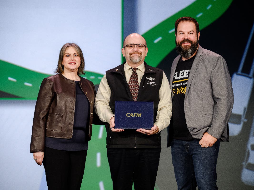 Brad Hunter, assistant director of the Fleet Division, accepts the award.