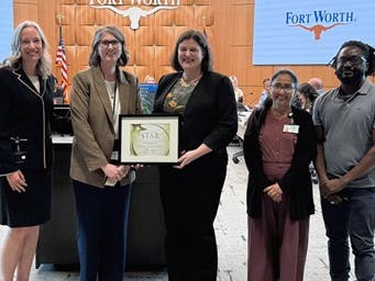 Assistant City Manager Dana Burghdoff and Economic Development Director Jessica Rogers are joined by department staff to accept the Economic Development Transparency Star.