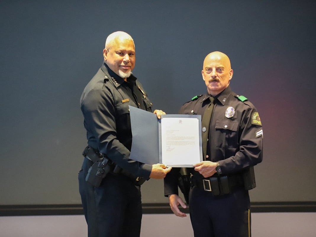 Dallas Police Chief Daniel C. Comeaux and Senior Corporal Michael Bennett.