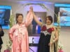 Sukie Hendricks and Arpita Gogoi meet at the Bridge of Peace, representing friendship across cultures and nationalities.