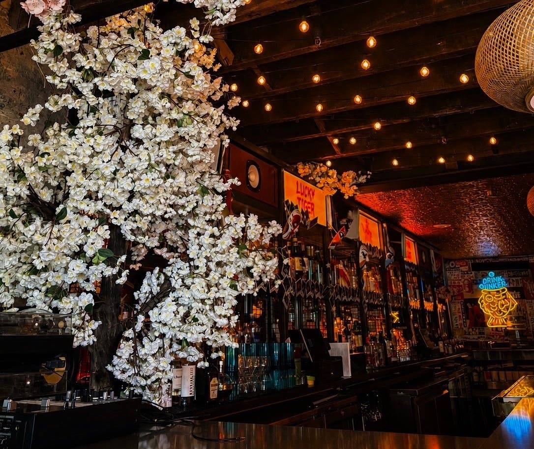 Lucky Tiger, from the team behind Motel No Tell, brings a multi-room, lantern-lit cocktail experience to the Financial District, complete with a hidden vinyl bar, Southeast Asian-inspired dishes, and a dual-level cocktail program.
