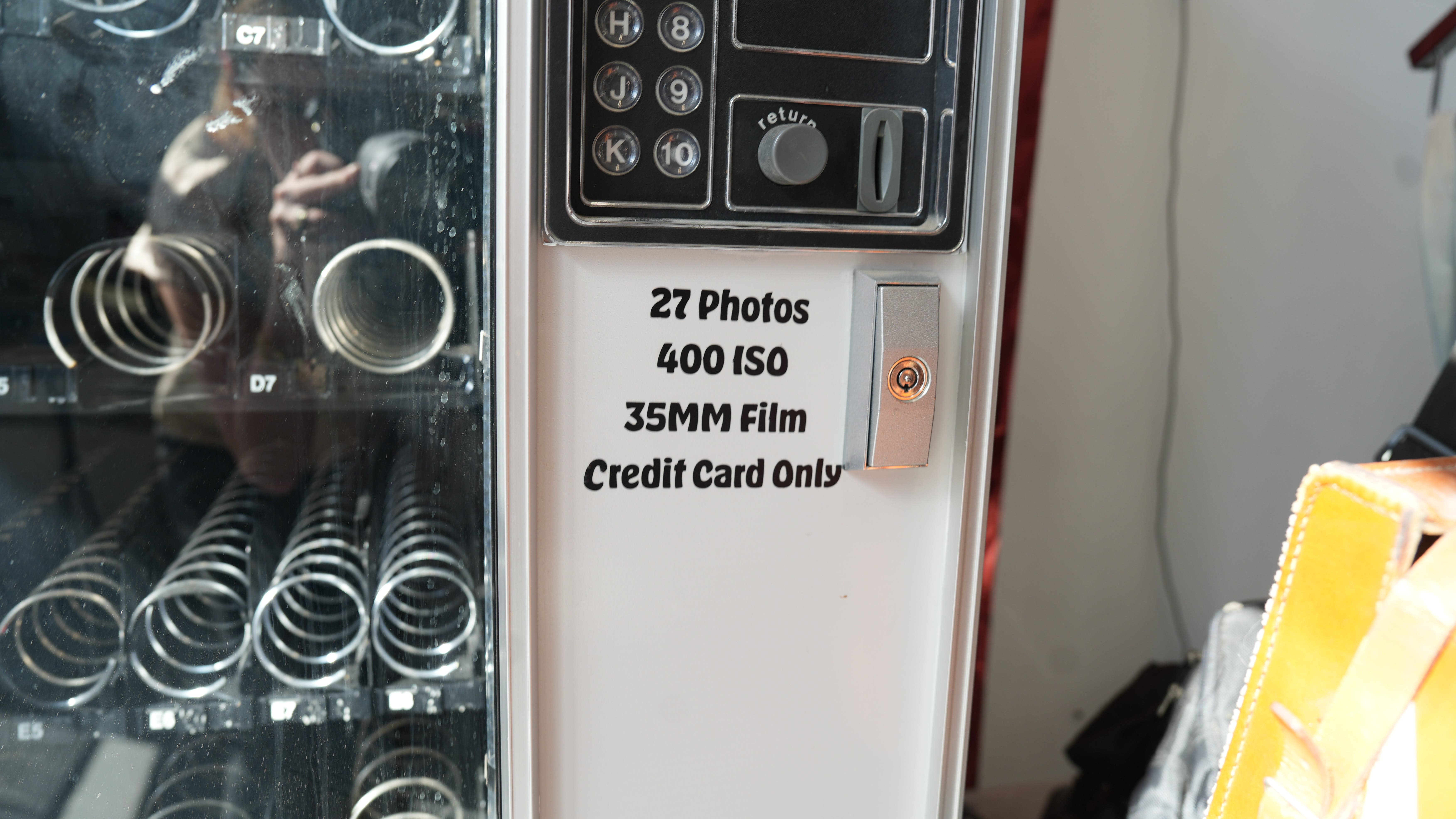 3. A film vending machine stocked with photographic film stands inside the Bushwick Community Darkroom in Brooklyn, providing members and visitors with supplies for analog photography projects.