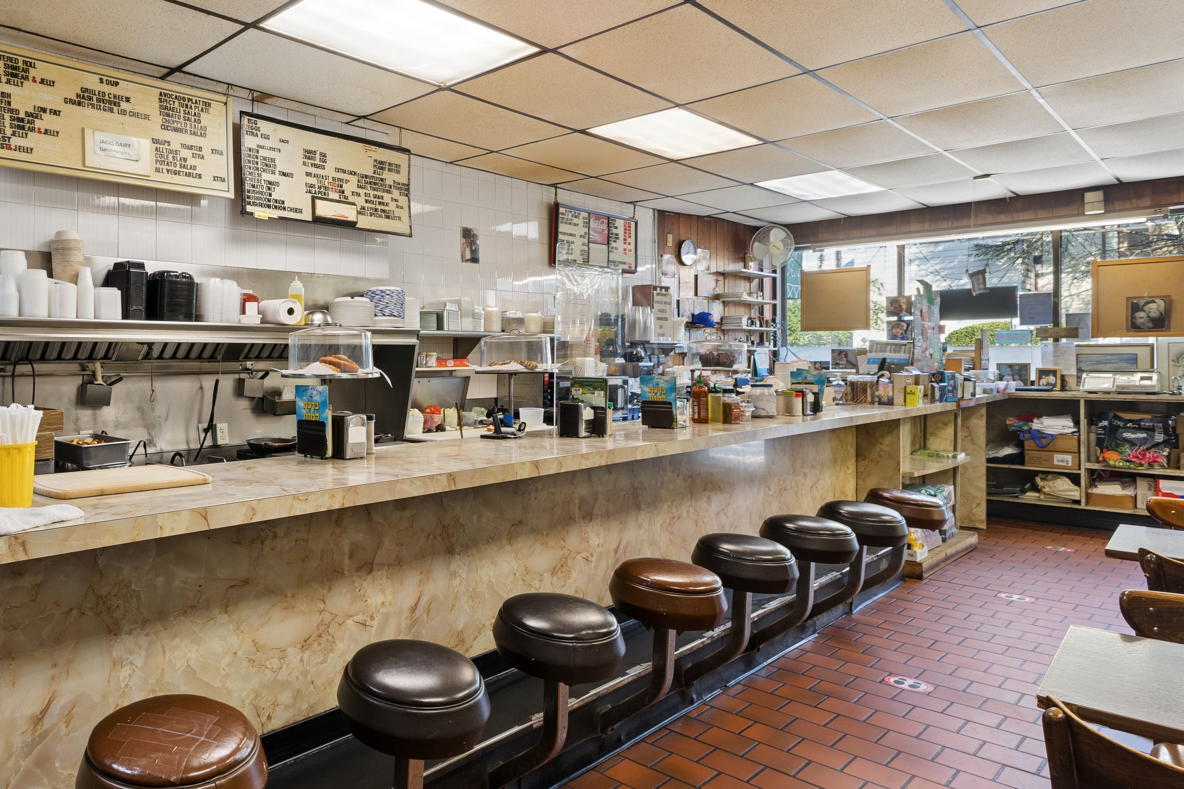 The restaurant’s compact dining room has four wooden tables that seat a total of 12 people, along with a counter that accommodates 10 more.
