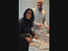 Club President Shivonne Mathison joins club member Matt Stendardi to add bookplates to the dictionaries.