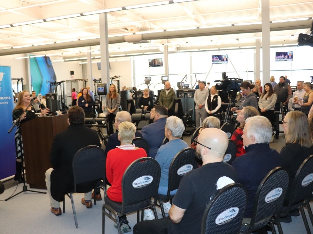Crystal Messer, VP of operations for the Lehigh Valley region of River Crossing YMCA, welcomes members, staff, volunteers and elected officials to the ribbon-cutting ceremony unveiling the newly renovated wellness center at the Easton branch on Feb. 16.