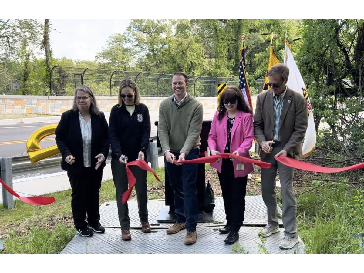 DPW Director Karen Henry is joined by Anne Arundel County Executive Steuart Pittman and District 3 Councilman Nathan Volke to officially cut the ribbon and open the Magothy Bridge Road Bridge.