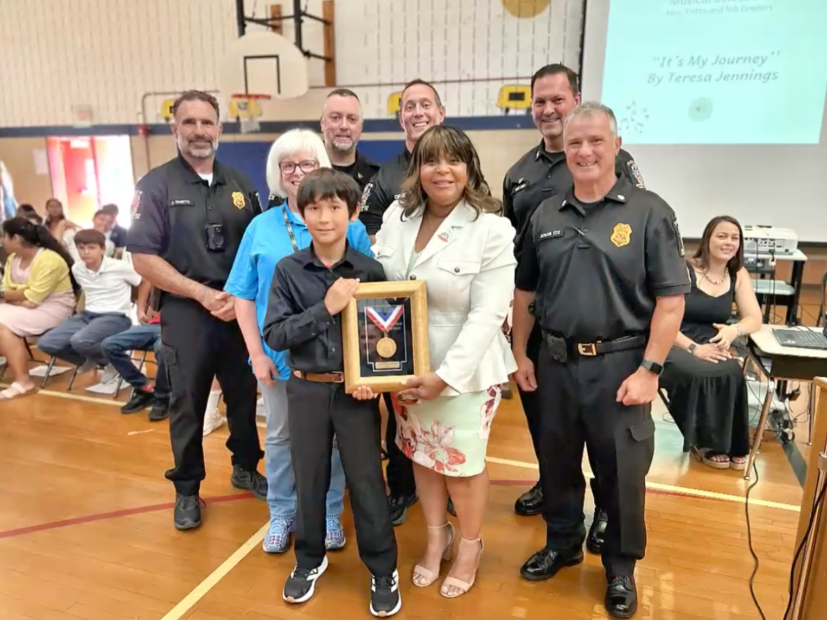 A fifth grader from Brooke Grove Elementary School was honored for preventing a distracted student from crossing into the path of an oncoming vehicle.