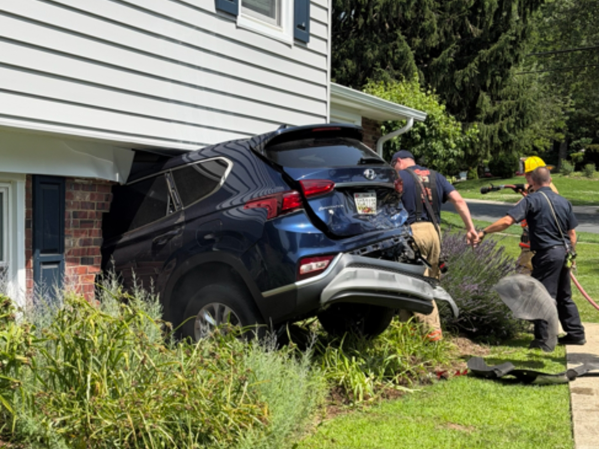 A teenager was taken into police custody on Tuesday after crashing into an off-duty officer and then a two-story Silver Spring home.