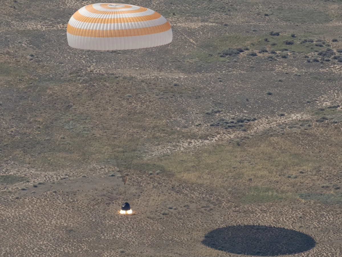 The Soyuz MS-28 spacecraft is seen as it lands in a remote area near the town of Zhezkazgan, Kazakhstan with Expedition 74 NASA astronaut Chris Williams, and Roscosmos cosmonauts Sergey Kud-Sverchkov, and Sergei Mikaev aboard, Sunday, July 26, 2026.