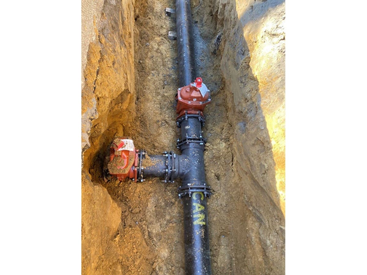 A photo shows the kind of work that's necessary to replace or upgrade lines along Central Street in Framingham.