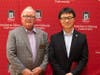 NIU College of Engineering and Engineering Technology Dean Dave Grewell (left) with ISYE Associate Professor Ziteng Wang at a ceremony honoring Wang and others on Northern Illinois University's DeKalb campus. Wang is an eight-year resident of Schaumburg.