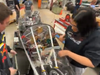 In a screen grab of the NIU commencement video featuring her, Aditi Venkatesh works on the Huskie Motorsports vehicle on the DeKalb campus of Northern Illinois University.