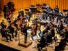 Aditi Venkatesh (lower right) plays in the NIU Philharmonic Orchestra, a role she played for four years as a violinist. She also created a composition for the orchestra.