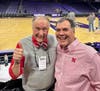 John Manchester {R) of Windy City Sweets in Chicago's Lakeview neighborhood and Nebraska basketball announcer Kevin Pavelka. Manchester gifted Pavelka a molded chocolate basketball with the Nebraska logo. 