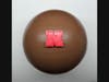 Windy City Sweets in Chicago's Lakeview neighborhood creates artisan chocolates for any occasion. Pictured is molded chocolate basketball with Nebraska logo, perfect for March Madness. Any team logo can be added.