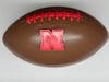 Molded chocolate football with Nebraska logo created by Windy City Sweets in Chicago's Lakeview neighborhood. 