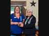 Pat King (on right) presenting Ripton Parish Chapter gavel to Regent Christine Schmied