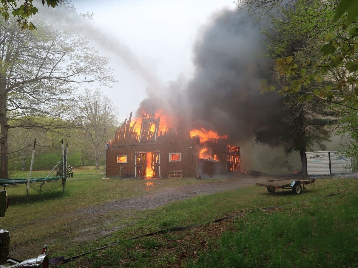 Firefighters responded to a large barn fire on Judd Road in Monroe on Wednesday morning.