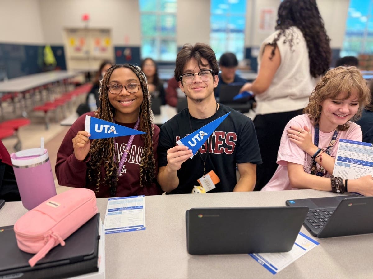 Harmony School of Innovation-Fort Worth seniors celebrate on-the-spot admission during a UTA college application drive.