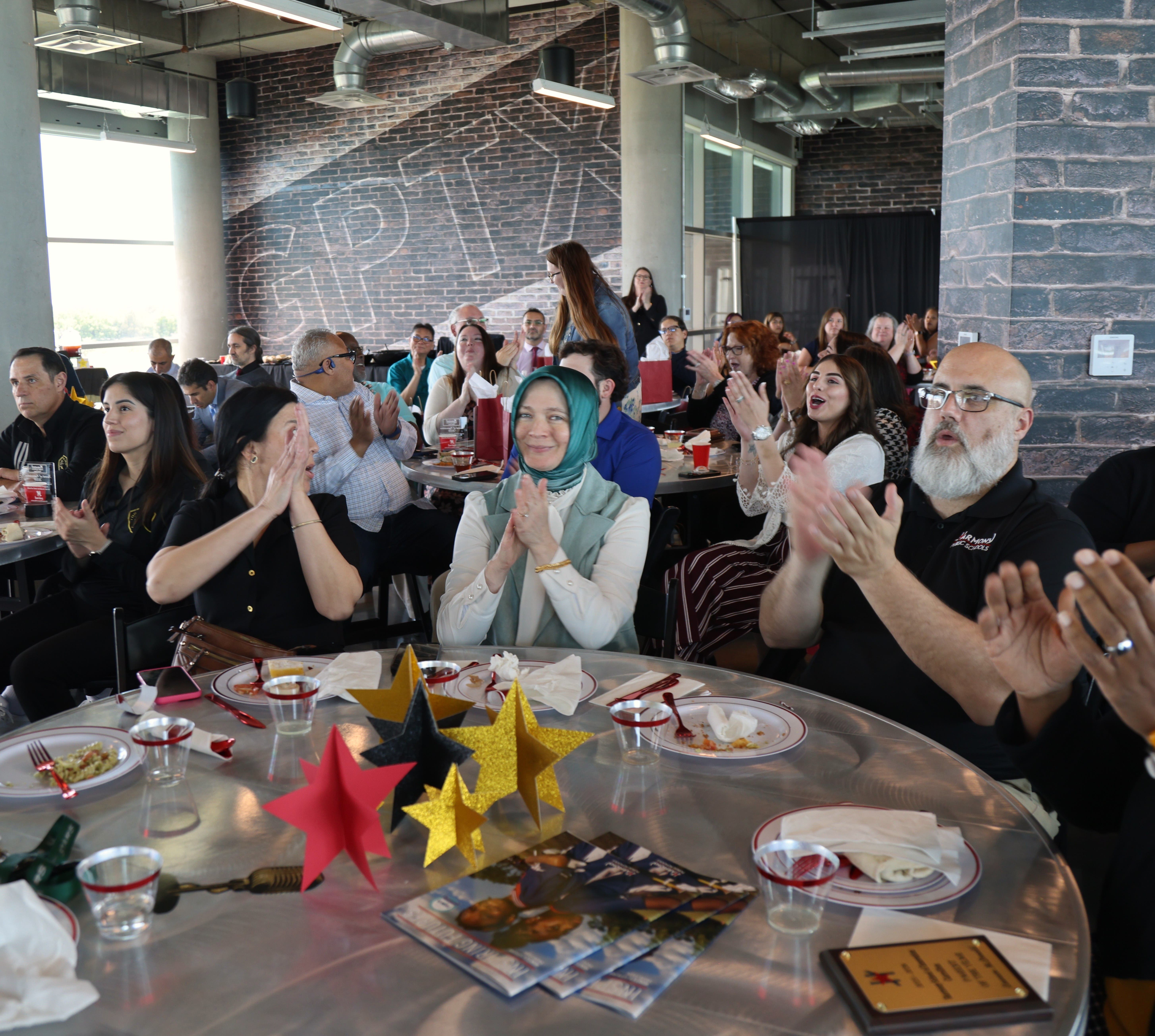 Community partners, families and educators applaud honorees during Harmony Public Schools-North Texas’ annual Partners in Education Celebration in Grand Prairie.