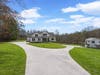 Main home with a detached guest house with 2 separate living areas on each floor.
