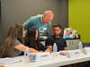 Denny Mosseller assists neighbors in ESL classes at The Academy, the education program at The Storehouse Community Center.