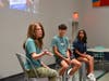 Lucas Gonzalez and Nandika Gupta interview Storehouse CEO Candace Winslow during a Saturday morning meeting