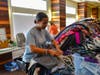 Tyler Adams sorting clothing donations for Joseph's Coat Clothing Closet, a program of The Storehouse Community Center